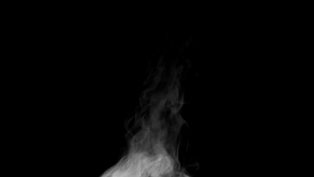 Steam for Food. White steam spins and rises from the pan. White smoke rises from a large pot, which is located behind the frame. Isolated Steam seamless loop black background.