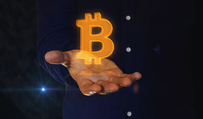 Bitcoin blockchain crypto currency symbol over hand