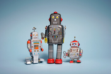 Fototapeta premium Three wind-up robot friends