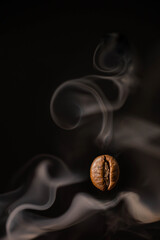 steaming coffee bean. closeup of a coffee bean. roasted steaming coffee. coffee background. copy space with coffee beans