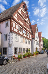 Fototapeta na wymiar Nördlingen, Germany. Facades of old houses on a stone-paved street