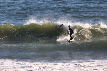 Surfing Rincon cove in California