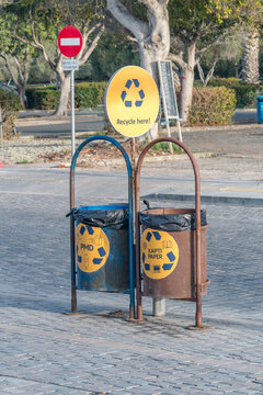 Paphos, Cyprus - April 2, 2022: Recycle bins on the street. PMD and paper bins in Cyprus.