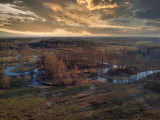 Picturesque landscape of the middle of Poland illuminated by the falling slogan.