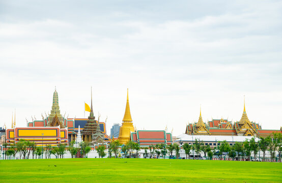 Grand palace or well known among tourist as Temple of the Emerald Buddha or local known Wat phra keaw at on a cloudy rainy sky day at Bangkok, Thailand with copy space.