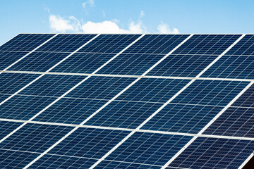 Solar panels on the roof of a house close-up. The solar panels are stacked close to each other.