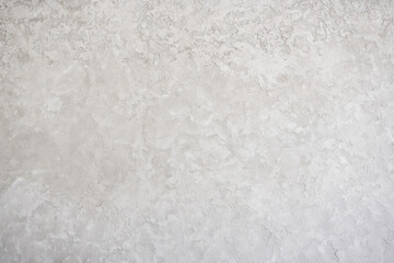 artistic plaster on a gray and white wall. Repairs. elements of wall decor. copy space. texture. background.