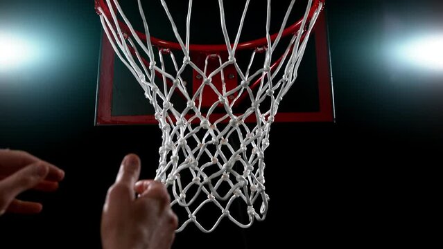 Super slow motion of basketball player hitting the basket. Filmed on high speed cinema camera Phantom, 1000fps.