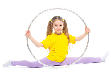 Little cute girl with hula hoop doing stretching. Isolated on white background.