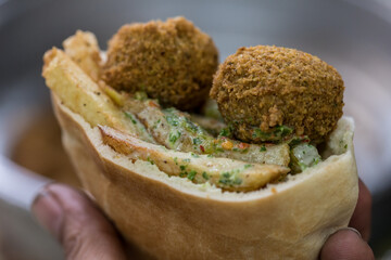 Falafel in pita bread with salad