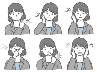 色々な部分が痛むスーツの若い女性