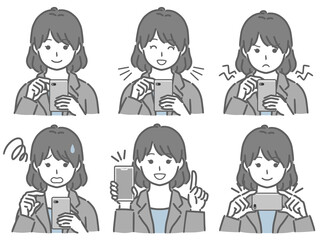 スマホを操作するスーツの若い女性