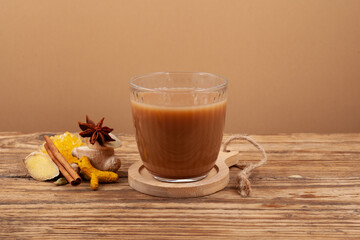 Popular Indian warming drink. Black tea brewed with addition of milk, ginger, variety of spicy and spices