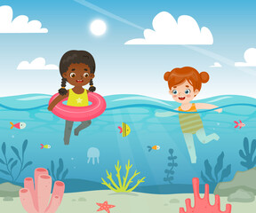 Obraz na płótnie Canvas Pretty baby girls swimming in the sea. Adorable cartoon kids in the tropical ocean.