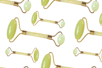Seamless pattern with jade massage roller on white.