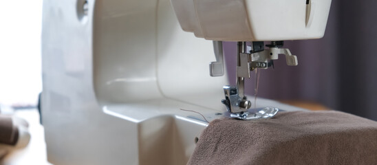 Sewing. Recycling Made by hand from home.sewing machine and the project quarantine, lockdown.Hobby,meditation,zero waste,recycling.Girl sews clothes home on sewing machine, ecology,sewing backround