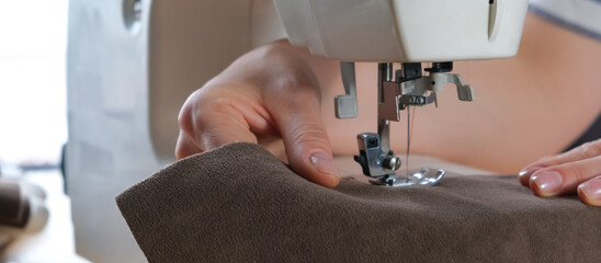 Sewing. Recycling Made by hand from home.sewing machine and the project quarantine, lockdown.Hobby,meditation,zero waste,recycling.Girl sews clothes home on sewing machine, ecology,sewing backround