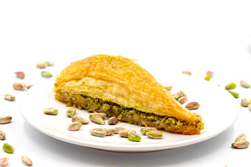 Carrot slice baklava on a white background. Traditional Mediterranean cuisine delicacies. close-up pistachio baklava. Local name havuc dilim baklava