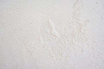 artistic plaster on a gray and white wall. Repairs. elements of wall decor. copy space. texture. background.