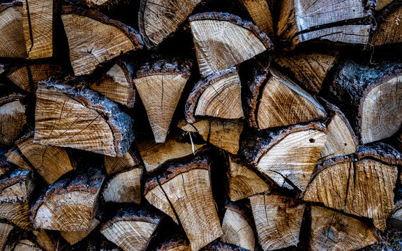 Close-up photo of harvested firewood for the winter, chopped and dried wood