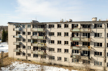 Abandoned white brick multistorey houses. Forgotten, abandoned ghost town Skrunda, Latvia. Former Soviet army radar station.