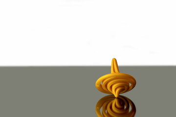 Yellow color child toy spinning