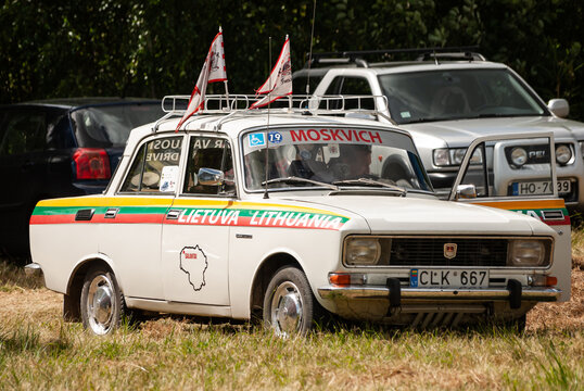 Kuldiga, Latvia - July 20, 2013: Old car Moskvich with flags, Lithuanian symbols and inscriptions.