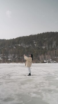 Young woman walking outdoors in winter