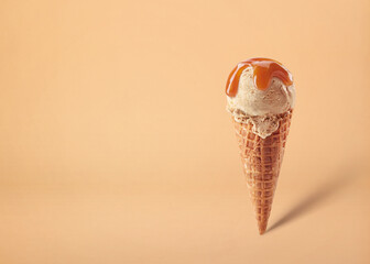 Caramel ice cream scoop in waffle cone