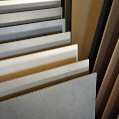Close up of porcelain stoneware for pavements. Exhibitor in specialized store of ceramic materials...