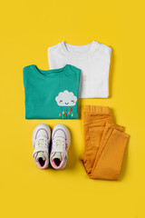 Set of kids clothes and accessories. Childrens T-shirt with jeans and sneakers. Fashion Baby outfit for spring, autumn or summer.