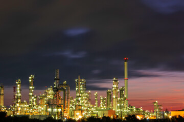 Plakat Oil​ refinery​ and​ plant and tower column of Petrochemistry industry in pipeline oil​ and​ gas​ ​industry with​ cloud​ slowing red sky