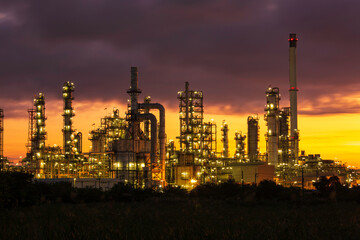 Oil​ refinery​ and​ plant and tower column of petrochemistry industry in pipeline oil​ and​ gas​ ​industry with​ sun red sky the morning