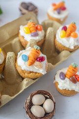 Obraz na płótnie Canvas Carrot cake cupcakes with cream cheese for Easter