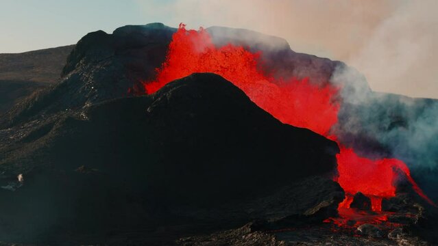 Dangerous Icelandic active volcano Fagradalsfjall in Iceland is erupting in 2021 with hot lava, explosion smoke and floating magma. Beautiful landscape. High quality 4k footage in slow motion