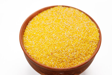 Corn groats in bowls and bags isolated on a white background. High quality photo
