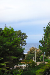 Landscape with scenic view of Saronic Gulf Aegean sea in the historic village of Vouliagmeni, Athens, Greece.