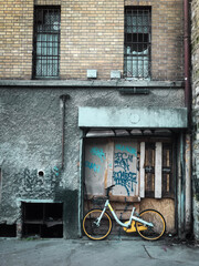 old bicycle in front of a brick wall