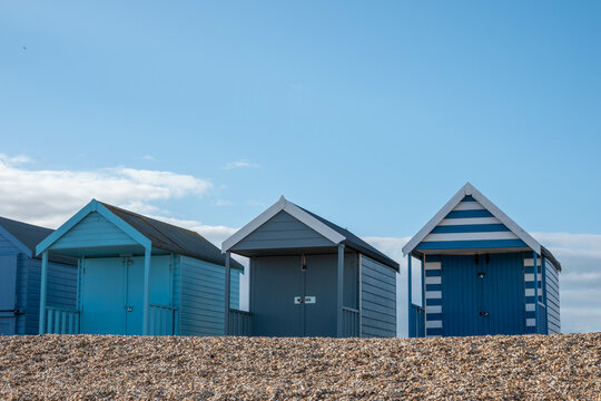 blue painted beachhuts on the beach at Calshot Hampshire England	