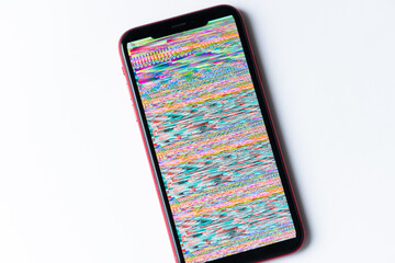 smartphone, mobile phone closeup. Glitches, distorted, corrupted image with colorful lines on the...