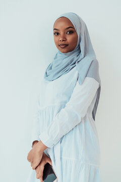 An African Muslim Woman Using A Smartphone On A White Background