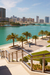 Adu Dhabi park, water high-rise buildings in the background
