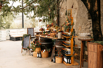 a fair of food and wine. table with food outside in the yard. Provence style