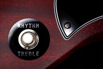 Close-up of pickup selector on a cherry guitar