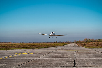 Small plane in the air. Blue sky