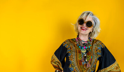 Funny portrait of mature woman. Beautiful lady have fun dressed with seventies costume