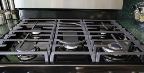 View of a black modern stove top. 
