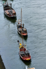 Obraz premium Beautiful view of Douro River with the traditional Rabelo wine boats in Porto, Portugal