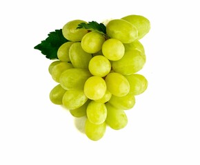 Green grapes with fruit leaves isolated on white background.