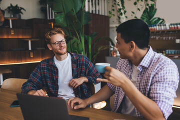 Multiracial business men working in office space